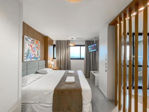 En eller flere senge i et værelse på Flat Elegante com Muito Estilo no Edificio Vertigo