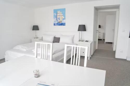 En eller flere senge i et værelse på SPA Hotel "Villa Bello"