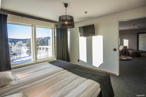 Säng eller sängar i ett rum på Laponia Hotell & Konferens