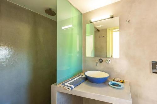 a bathroom with a sink and a mirror at Luxury Crete Villa Villa Stella Maris Beautiful Landscaped Views & Private Heated Pool Bbq 2 Bedrooms Mylopotamos in Panormos Rethymno