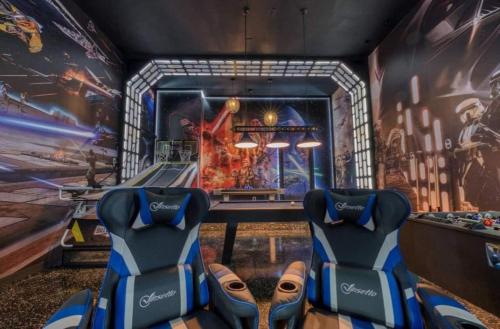 a game room with a table and a gaming console at Experience Luxury In Your 11 En-suites Mansion in Orlando