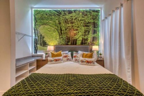 a bedroom with a large window with a large bed at Experience Luxury In Your 11 En-suites Mansion in Orlando