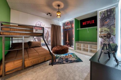 a bedroom with a bunk bed and a camera in it at Experience Luxury In Your 11 En-suites Mansion in Orlando