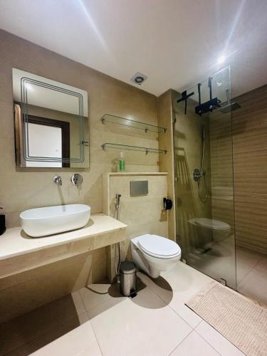 a bathroom with a sink and a toilet and a shower at 3 bedroom apartment in Marrakesh