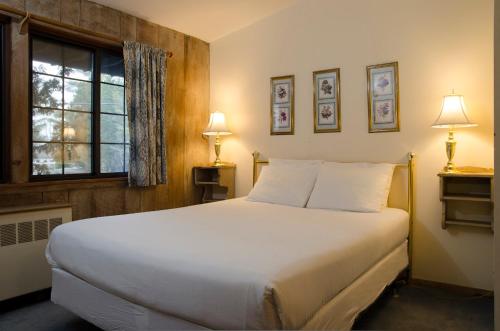 Katil atau katil-katil dalam bilik di Summit Lodge
