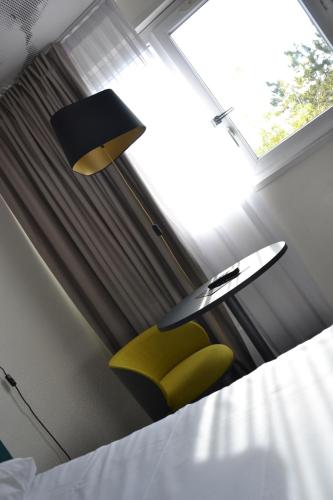 Postel nebo postele na pokoji v ubytování ibis Chambery