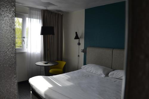Postel nebo postele na pokoji v ubytování ibis Chambery
