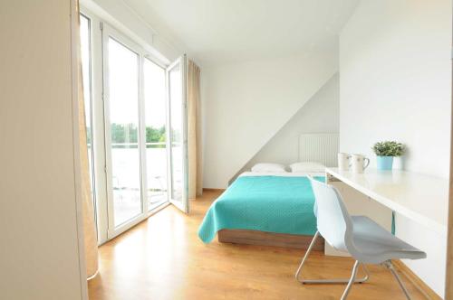 En eller flere senge i et værelse på Pokoje minutka do Monciaka