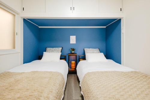 Ένα ή περισσότερα κρεβάτια σε δωμάτιο στο uni hakodate