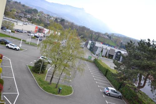 an aerial view of a parking lot with cars parked at ibis Chambery in Chambéry