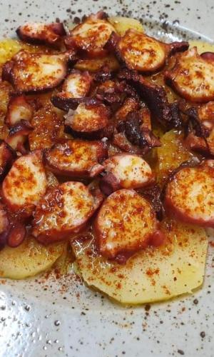 a close up of a plate of food with food at Hotel Nuevo Ondina in Begur