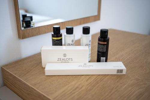 a counter with four bottles of hair products on it at Sweet Sissi Homes in Sissi