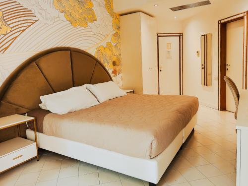 a bedroom with a large bed with a map on the wall at Hotel President - Vintage Hotel in centro in Riccione
