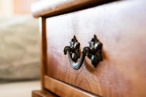 a close up of a wooden drawer with a handle at Hradní Ubytování in Hněvětice