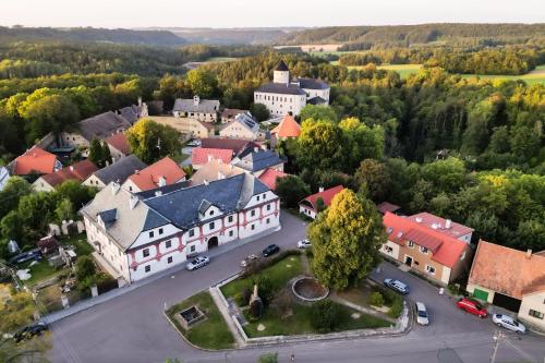 an aerial view of a town with a castle at Hradní Ubytování in Hněvětice