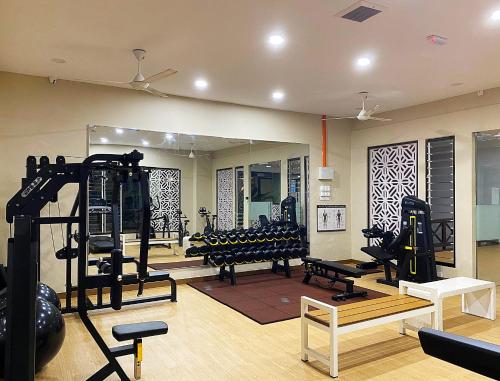 a room with a gym with treadmills and other equipment at Seanest Residence 贤巢民宿 14 "Owned by Amadel Residence" in Melaka
