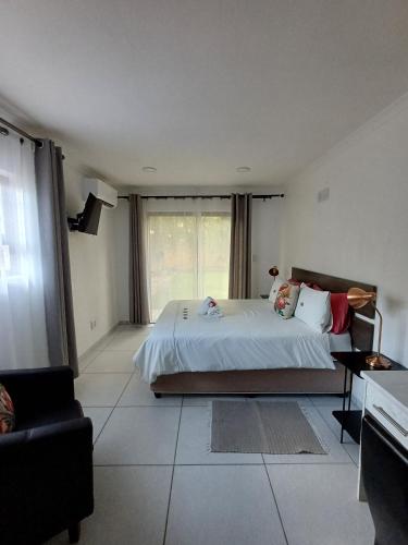 Postel nebo postele na pokoji v ubytování Capbon Guesthouse