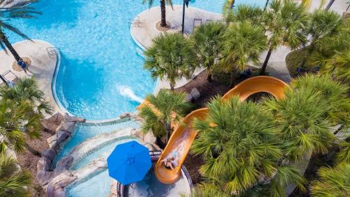 an aerial view of a water slide at a resort at Luxurious Townhome in Solterra Resort - SOLT01 in Davenport