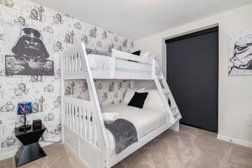 a bedroom with a white bunk bed in a room at Luxurious Townhome in Solterra Resort - SOLT01 in Davenport