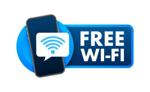 a free wifi sign and a cell phone with a wifi symbol at Matoshri nivas lodge in Akalkot