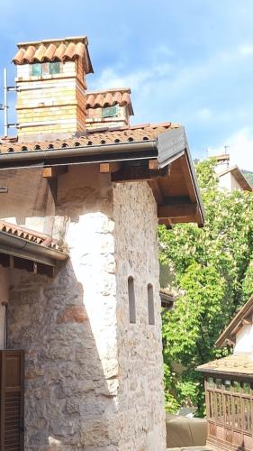 a building with a tower on top of it at NEL CUORE DEL FESTiVAL -fascino anni '50 con balcone in centro storico- in Trento