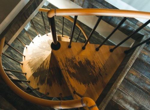 a wooden spiral staircase in a building at Lakeview - by The Chalets in Logan