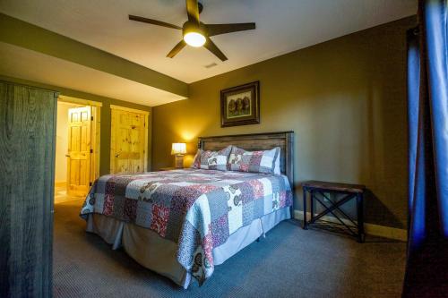 a bedroom with a bed and a ceiling fan at Lilypad - by The Chalets in Logan