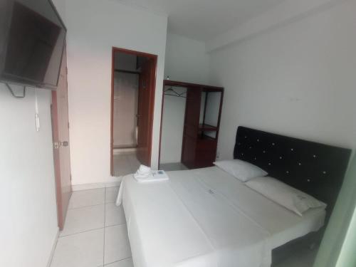 Postel nebo postele na pokoji v ubytování HOTEL LA FONTANA