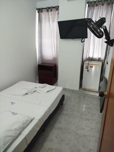 Postel nebo postele na pokoji v ubytování HOTEL LA FONTANA