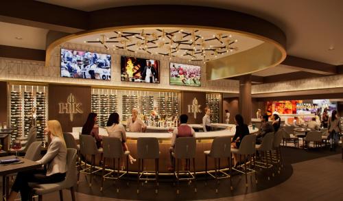 a rendering of a restaurant with people sitting around a bar at Caesars Republic Lake Tahoe in Stateline