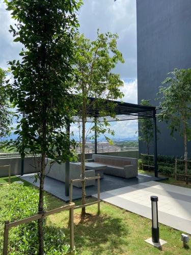 a view from the roof of a building with a tree at Tulips Cozy Homestay For You in Shah Alam