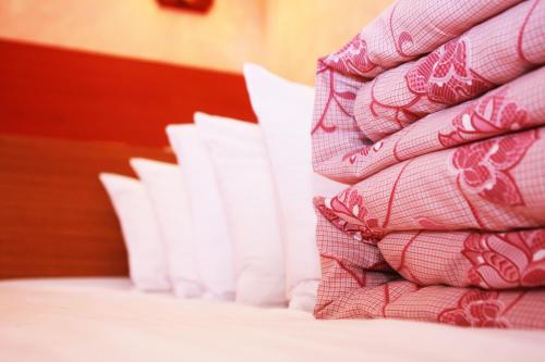 Postel nebo postele na pokoji v ubytování East Commercial Affairs Hotel