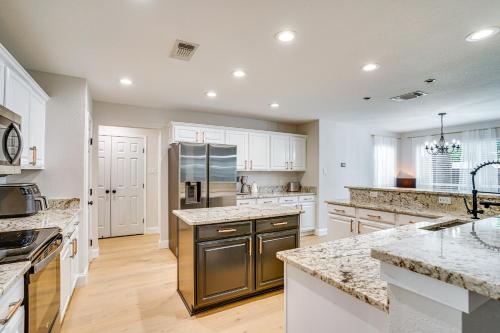 a kitchen with white cabinets and stainless steel appliances at 2 Mi to Old Town Spacious Burleson Vacation Home in Burleson