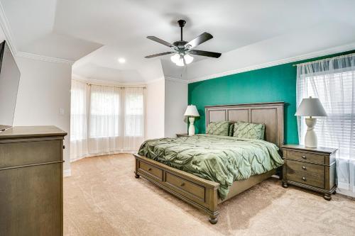 a bedroom with a bed and a ceiling fan at 2 Mi to Old Town Spacious Burleson Vacation Home in Burleson