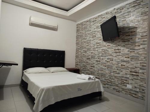 TV a/nebo společenská místnost v ubytování HOTEL LA FONTANA