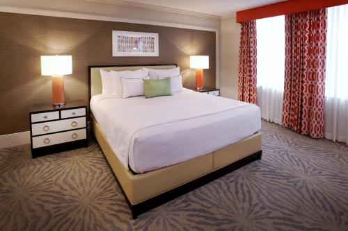 a large bed in a hotel room with two lamps at Resorts Casino Hotel Atlantic City in Atlantic City