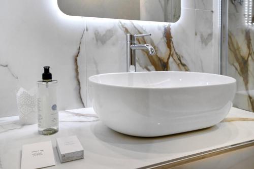 a white bowl sink on a counter in a bathroom at Hotel Castel Vecchio in Castel Gandolfo