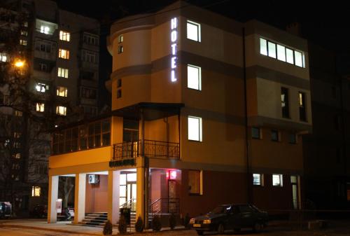 a building with a car parked in front of it at City Club European in Chernivtsi