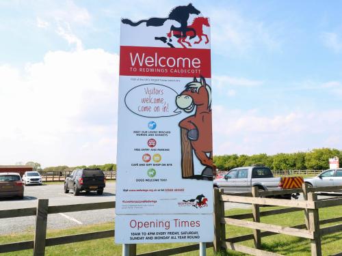 a sign in a parking lot with a horse on it at No 3 Foxburrow Hang in Fritton Norfolk