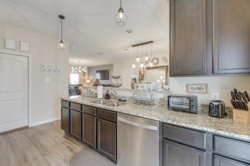 a kitchen with a sink and a counter top at Pet-Friendly Home with Fenced Yard in Manor in Manor