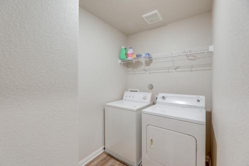 a small laundry room with a washer and dryer at Pet-Friendly Home with Fenced Yard in Manor in Manor