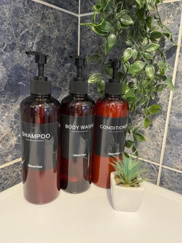 a group of three bottles sitting on a counter at Apartman Selaković in Bela Crkva