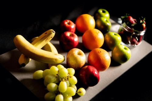 a bunch of fruits sitting on a table at Holiday Inn - Manchester - Oldham by IHG in Manchester