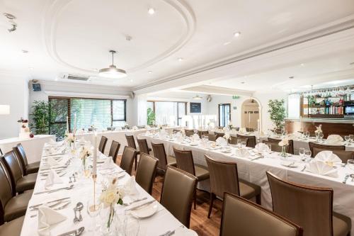 a large banquet room with tables and chairs at Holiday Inn - Manchester - Oldham by IHG in Manchester