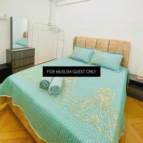 a bedroom with a bed with a sign that reads for musthm guest only at Fadzly Homestay D'Jasin in Jasin