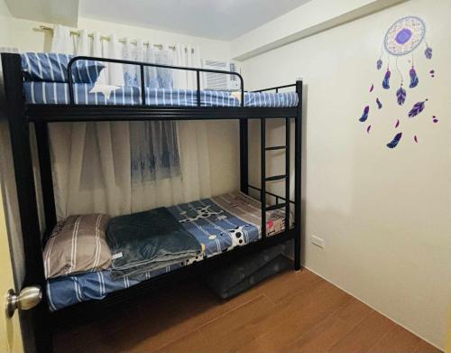 Postel nebo postele na pokoji v ubytování Seawind 2BR Condo near Samal Ferry Wharf