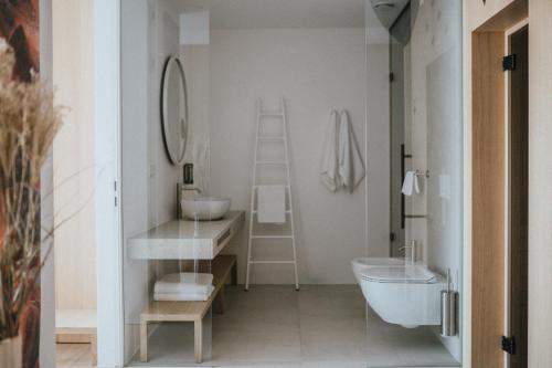 Ванная комната в Brondstott Farm & Suites Kronplatz