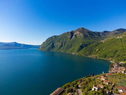 an aerial view of a lake with mountains at Costa Blu - Pool & terrace lake view in Riva di Solto