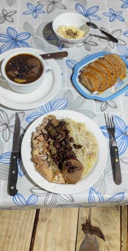 a table with plates of food on a table at Pueblo Nómade in Tranqueras