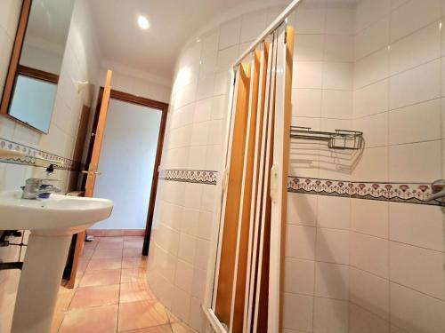a bathroom with a sink and a shower at Villa ALVAMAR in Blanes